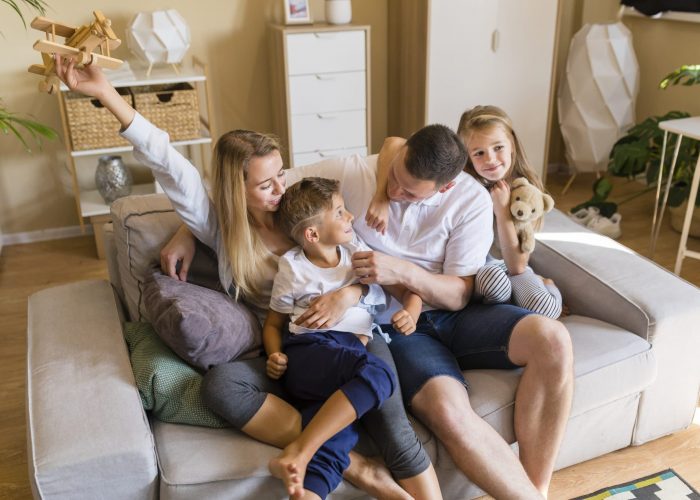 family-playing-in-the-living-room-with-toys